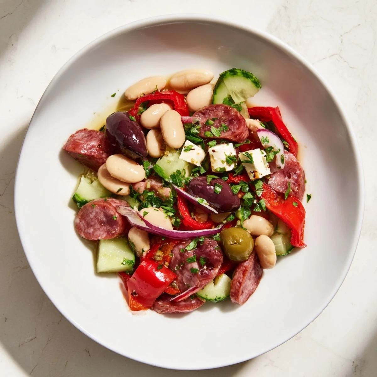 Cool, refreshing Italian Antipasto Bean Salad, a light starter or meal, with flavorful ingredients and zesty dressing.