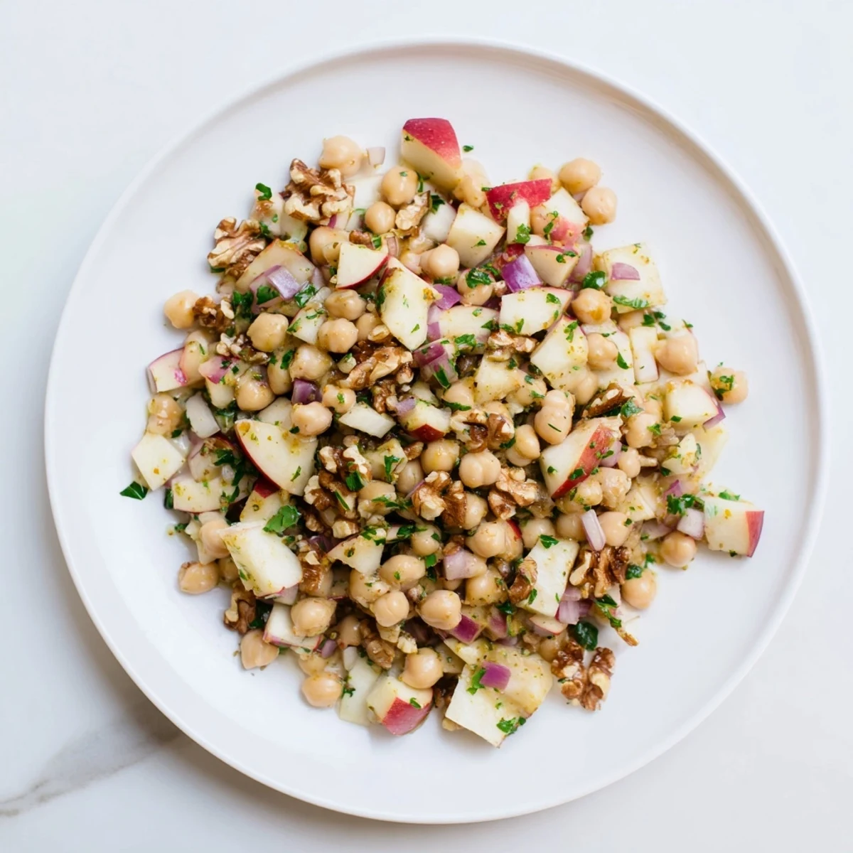 Fresh Fall Harvest Apple and Chickpea Salad, showcasing a sweet and tangy honey-mustard dressing.