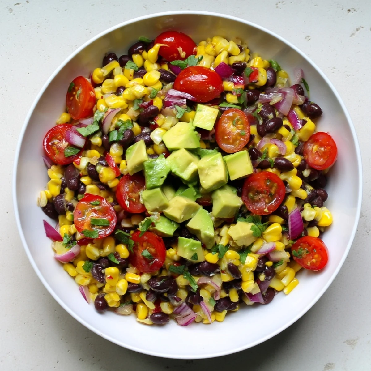 A colorful bowl of Southwestern Black Bean and Corn Salad, a perfect vegetarian and gluten-free side.
