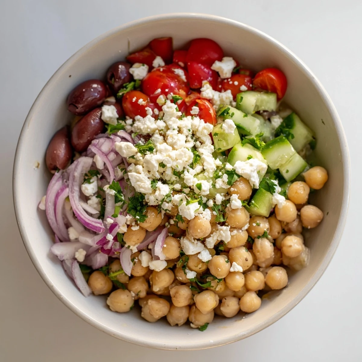 A close-up of a delicious Mediterranean Chickpea and Feta Bowl, ready to be enjoyed with fresh herbs.