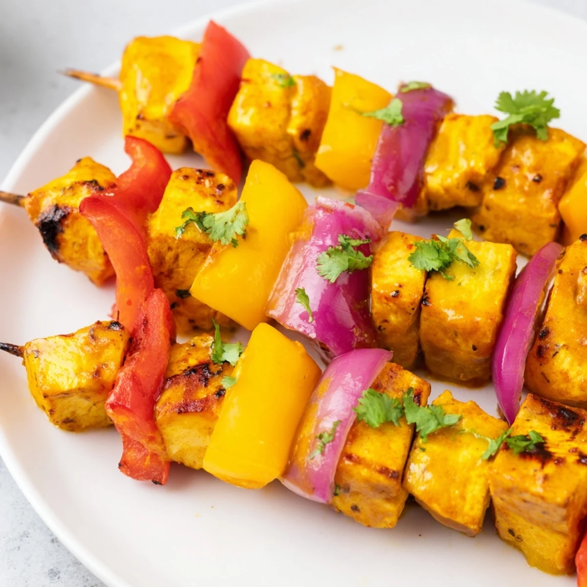 Juicy Mango Lime Chicken Skewers with colorful peppers, grilled to a delightful char, ready to serve.