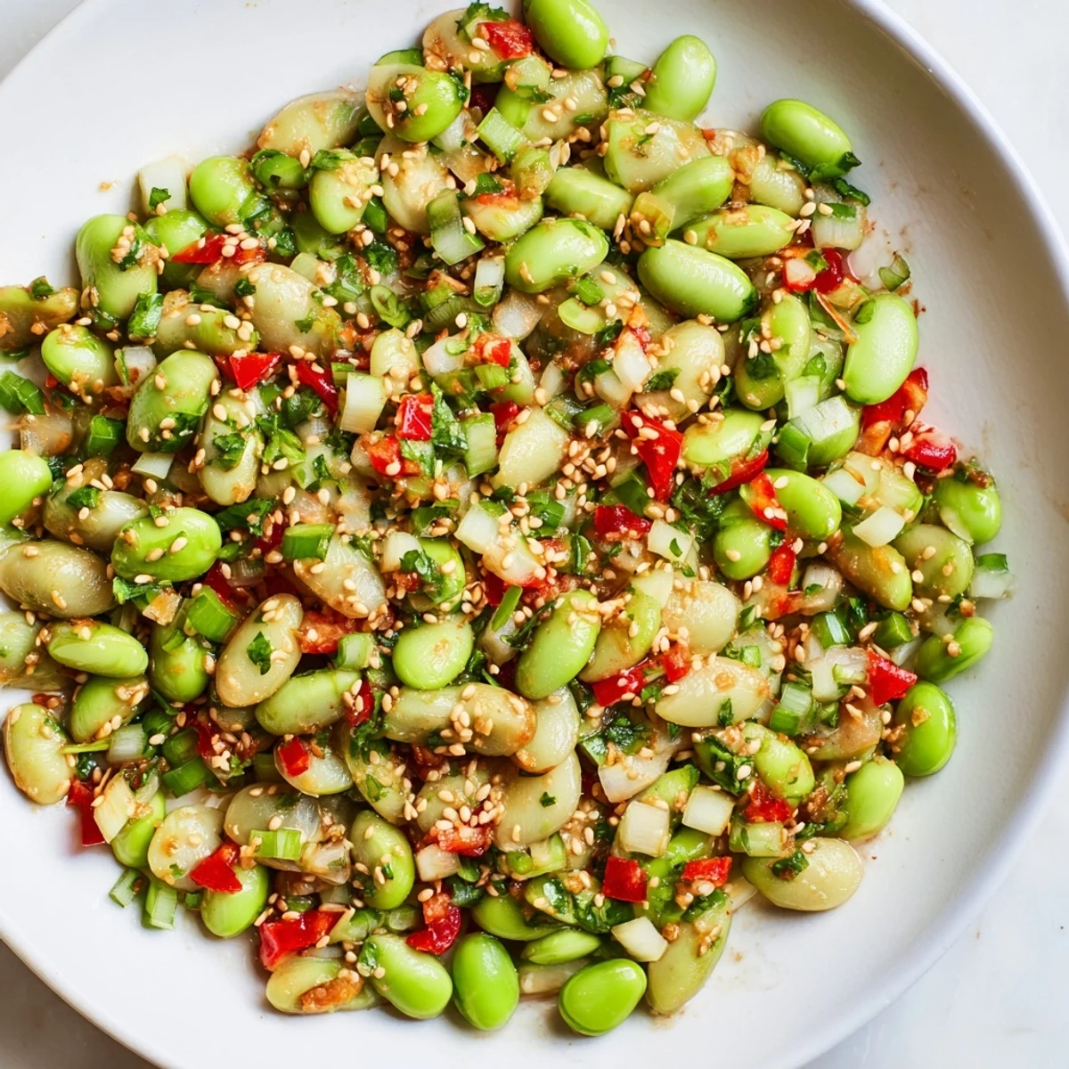 Vibrant edamame salad with crisp cucumber and a savory sesame dressing, ready to enjoy.