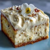 Zesty Lemon Sunshine Cake, adorned with delicate blooms, ready for a festive gathering.