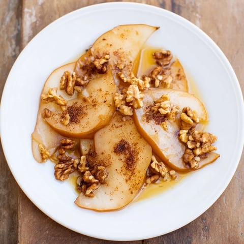 Maple-Warm Cozy Plate: Caramelized Pear and Walnut Bake, glistening with caramelized pears and toasty walnuts, ready to serve.