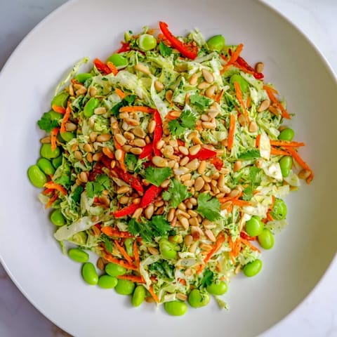 A bright bowl showcasing this Crunchy Cabbage and Edamame Salad, perfect for a fresh summer side.