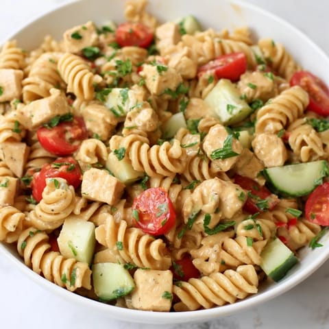 Serving suggestion for Honey Mustard Chicken Pasta Salad, featuring crisp vegetables and tender chicken tossed in a creamy, tangy dressing.