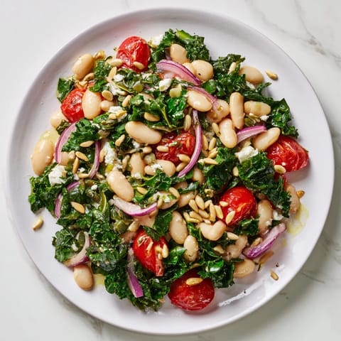 Freshly massaged kale and creamy white beans tossed with cherry tomatoes and a bright lemon-garlic dressing in this White Bean and Kale Salad.