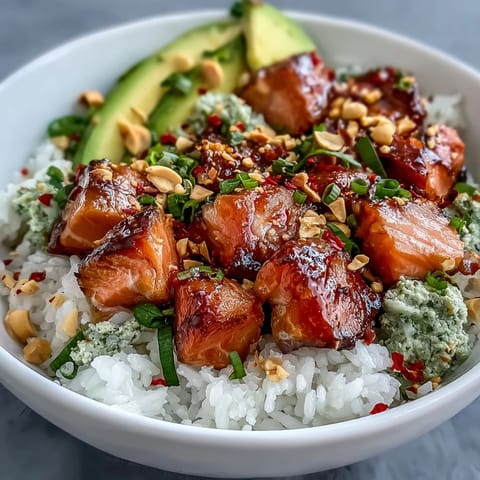 Vibrant Avocado Salmon Bowl with fluffy sushi rice, tender salmon, and creamy avocado slices.