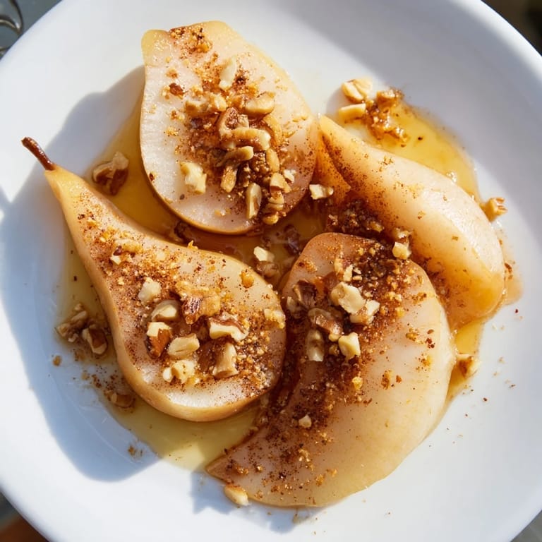 Warm Maple-Warm Cozy Plate featuring Caramelized Pear and Walnut Bake, topped with a dollop of creamy vanilla ice cream.