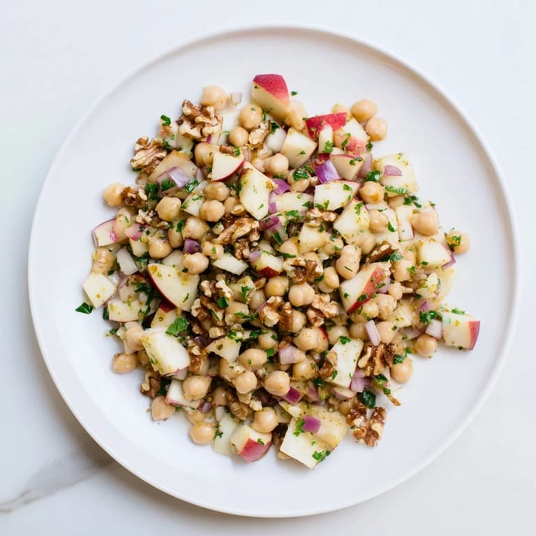 Fresh Fall Harvest Apple and Chickpea Salad, showcasing a sweet and tangy honey-mustard dressing.