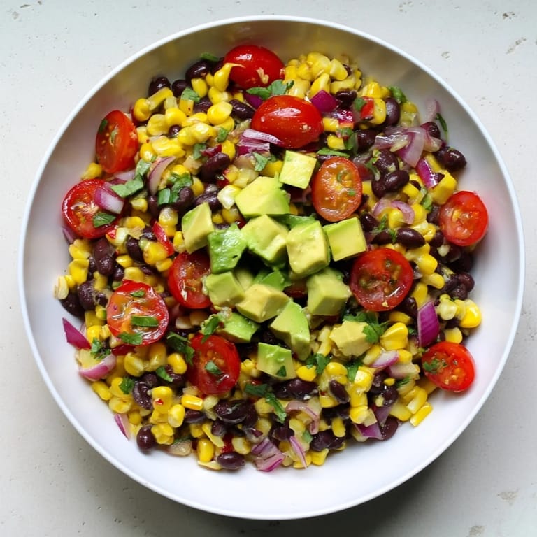 A colorful bowl of Southwestern Black Bean and Corn Salad, a perfect vegetarian and gluten-free side.