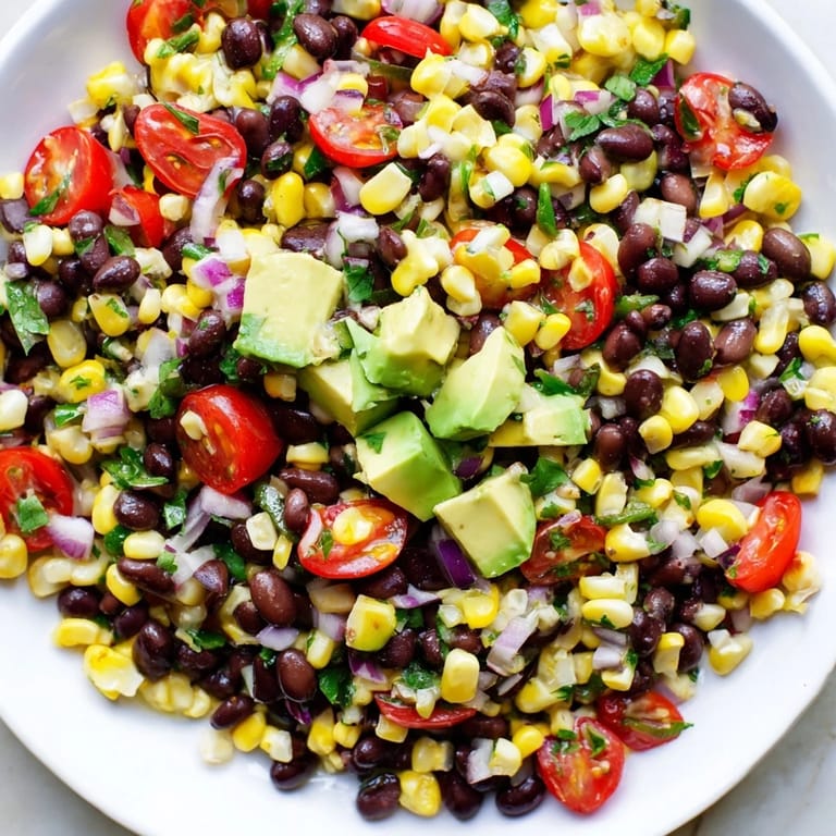 Showstopping Southwestern Black Bean and Corn Salad, ready to serve with refreshing lime and cilantro flavors.