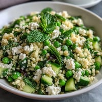 Vibrant Spring Pea and Mint Couscous Salad with fresh peas and herbs, a light and refreshing side for spring meals.